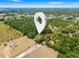 High aerial perspective showing a lush, wooded location of the property at 16284 Sandusky St, Brooksville, FL 34604