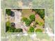 Aerial view of a property showing the foundation and lush surrounding trees at 16284 Sandusky St, Brooksville, FL 34604