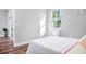 Cozy bedroom bathed in soft light, showcasing a comfortable bed and serene atmosphere at 16284 Sandusky St, Brooksville, FL 34604
