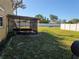 A screened-in patio area and a spacious yard at 1995 59Th S Cir, St Petersburg, FL 33712