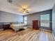 Spacious bedroom boasts hardwood floors and abundant natural light from large windows at 2165 Bolger Ave, Spring Hill, FL 34609