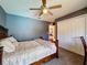 Comfortable bedroom boasts a ceiling fan and a large closet for ample storage at 2165 Bolger Ave, Spring Hill, FL 34609