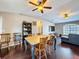 Inviting dining room features stylish hardwood floors and a charming ceiling fan at 2165 Bolger Ave, Spring Hill, FL 34609