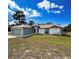 Traditional home featuring large, manicured front lawn with an attached two car garage at 2165 Bolger Ave, Spring Hill, FL 34609