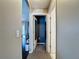 Inviting hallway with neutral colors and a glimpse into the home's living spaces, creating a warm and welcoming atmosphere at 2165 Bolger Ave, Spring Hill, FL 34609