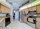 Modern kitchen features stainless steel appliances, including a refrigerator and oven at 2165 Bolger Ave, Spring Hill, FL 34609