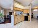 Open-concept kitchen with breakfast bar seamlessly connects to the dining and living areas at 2165 Bolger Ave, Spring Hill, FL 34609