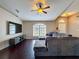 Open living room featuring vaulted ceilings, ceiling fan, recessed lighting, and a large window at 2165 Bolger Ave, Spring Hill, FL 34609