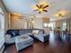 Comfortable living room featuring hardwood floors, vaulted ceiling, a ceiling fan, and lots of natural light at 2165 Bolger Ave, Spring Hill, FL 34609
