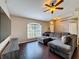 Comfortable living room featuring hardwood floors, vaulted ceiling, a ceiling fan, and lots of natural light at 2165 Bolger Ave, Spring Hill, FL 34609