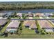 Aerial view showing the property's location on a waterfront lot with a spacious, well-maintained backyard at 2330 Tarragon Ln, Trinity, FL 34655