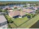 Overhead view of a home with a large backyard, waterside location, and beautiful landscaping at 2330 Tarragon Ln, Trinity, FL 34655