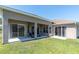 A covered patio with a lawn with a view to the canal at 2330 Tarragon Ln, Trinity, FL 34655