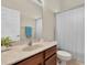 Bathroom vanity with a granite countertop, and a view of the toilet and shower at 2330 Tarragon Ln, Trinity, FL 34655