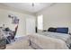 Carpeted bedroom featuring neutral tones, a desk, and a closet at 2330 Tarragon Ln, Trinity, FL 34655
