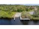 Community boat ramp with wooden pier, and surrounding Florida nature at 2330 Tarragon Ln, Trinity, FL 34655