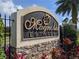 Elegant stone community entrance sign with lush landscaping welcomes residents and guests at 2330 Tarragon Ln, Trinity, FL 34655