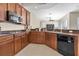 Well-equipped kitchen with tile flooring, ample counter space and cabinets for meal preparation and kitchen appliances at 2330 Tarragon Ln, Trinity, FL 34655