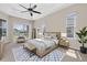 Spacious main bedroom with a ceiling fan, plenty of natural light, and a private backyard view at 2330 Tarragon Ln, Trinity, FL 34655