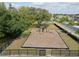 Aerial view of fenced community playground with modern equipment and a swing set at 2330 Tarragon Ln, Trinity, FL 34655