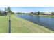 Scenic waterfront view showcasing the property's access to the beautiful lake at 2330 Tarragon Ln, Trinity, FL 34655