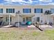 Rear exterior view showcasing the patio area and backyard of the property at 2400 Franciscan Dr # 8, Clearwater, FL 33763