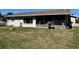 Backyard view highlighting the enclosed porch and well-maintained lawn at 2630 63Rd S Ave, St Petersburg, FL 33712