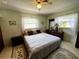 Cozy bedroom with a comfortable bed, dresser, and two windows at 2630 63Rd S Ave, St Petersburg, FL 33712