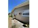 Side view of the exterior with new siding and energy-efficient windows for comfortable living at 2630 63Rd S Ave, St Petersburg, FL 33712