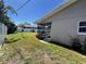 The exterior of the home features a green lawn and an enclosed porch at 2630 63Rd S Ave, St Petersburg, FL 33712