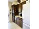 Cozy kitchen featuring wood cabinets, a white refrigerator, and light countertops at 2630 63Rd S Ave, St Petersburg, FL 33712