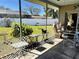Enclosed lanai with views of the backyard and lawn, featuring comfortable furniture at 2630 63Rd S Ave, St Petersburg, FL 33712