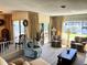 Comfortable living room with neutral tones, large windows, and access to outdoor patio at 2630 63Rd S Ave, St Petersburg, FL 33712