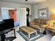 Inviting living room with neutral tones, tile floors, and comfortable seating at 2630 63Rd S Ave, St Petersburg, FL 33712