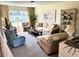 Cozy living room featuring comfortable seating, a large window, and stylish decor at 2630 63Rd S Ave, St Petersburg, FL 33712