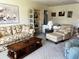 Cozy living room with stylish furniture, a large window, and unique decorative elements at 2630 63Rd S Ave, St Petersburg, FL 33712