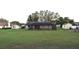 A large backyard with sheds and screened in patio at 29341 Rhodin Pl, Wesley Chapel, FL 33545
