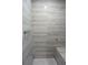 An updated bathroom offers a tiled shower with a built-in bench at 29341 Rhodin Pl, Wesley Chapel, FL 33545