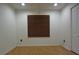 The bright bedroom has wood floors, a ceiling fan and a window with horizontal blinds at 29341 Rhodin Pl, Wesley Chapel, FL 33545