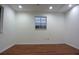 A large bedroom with laminate flooring and recessed ceiling lights at 29341 Rhodin Pl, Wesley Chapel, FL 33545