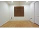 The bedroom offers wood floors, a ceiling fan and an adjacent closet at 29341 Rhodin Pl, Wesley Chapel, FL 33545