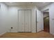 This bright bedroom offers an adjacent closet, wood floors, and base molding at 29341 Rhodin Pl, Wesley Chapel, FL 33545