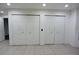 Spacious closet with tiled flooring, bright lighting, and shelving at 29341 Rhodin Pl, Wesley Chapel, FL 33545