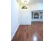 Bright foyer featuring hardwood floors, a high ceiling, and an arched window, creating a welcoming entrance at 29341 Rhodin Pl, Wesley Chapel, FL 33545