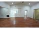 Spacious living room featuring laminate flooring, bright lighting and neutral paint at 29341 Rhodin Pl, Wesley Chapel, FL 33545