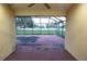 View from inside the screened in patio looking out to the backyard at 29341 Rhodin Pl, Wesley Chapel, FL 33545