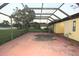 View of the screened patio looking out to the spacious backyard at 29341 Rhodin Pl, Wesley Chapel, FL 33545