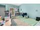 Bright bedroom featuring a queen-sized bed and a sliding glass door to the backyard at 3251 Shoal Line Blvd, Hernando Beach, FL 34607