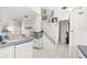 Hallway showcasing light walls, a staircase, and decorative wall art at 3251 Shoal Line Blvd, Hernando Beach, FL 34607