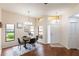 Dining area with laminate floors, chandelier, and windows at 3629 Muirfield Ct # 3629, New Port Richey, FL 34655